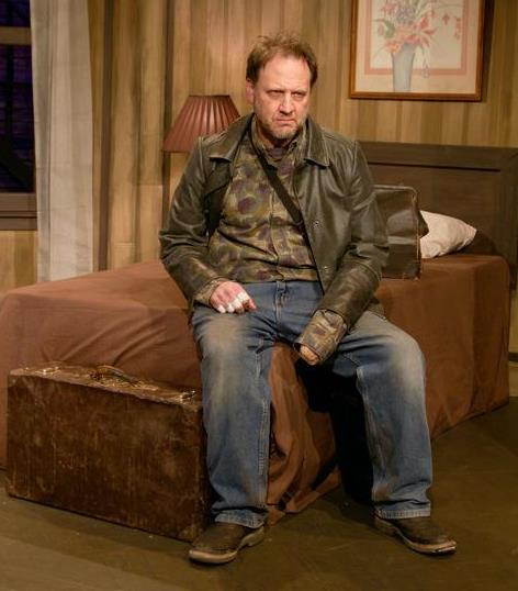 Gordon Carpenter is Carmichael in Theater Schmeater's production of A BEHANDING IN SPOKANE. Image by Dave Hastings.