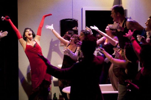 Allison Standley as Kate, Troy Wageman as Burrs and the cast of The Wild Party. Photo by Ken Holmes.