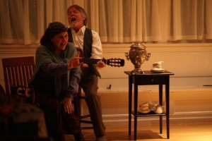 The ever-present Marina (Zhenya Lavy) and unfortunate Ilya Illich (Sean Patrick Taylor) stir it up with a rousing “Когда мы были на войне” Photo by Annie Paladino.